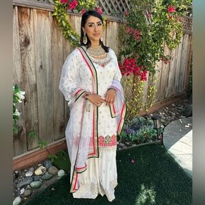 White Pakistani / Indian nikkah party wear sharara dress lehenga.
